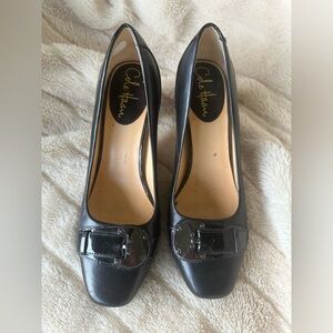 Black Cole Haan buckle toe heels